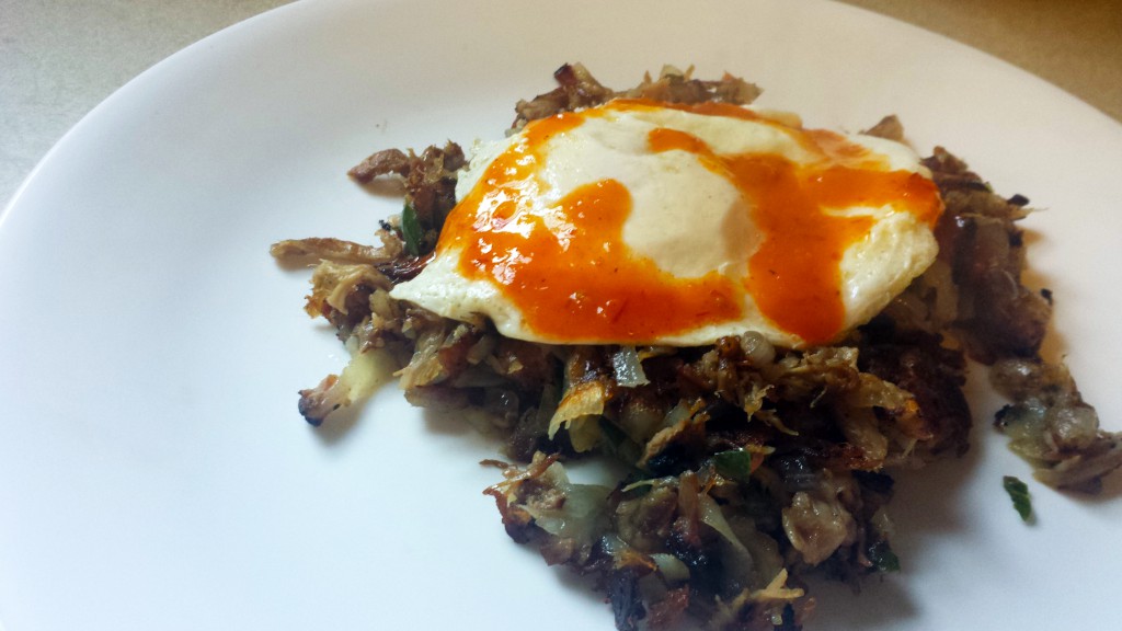Pulled pork hash with fried egg and peri-peri sauce