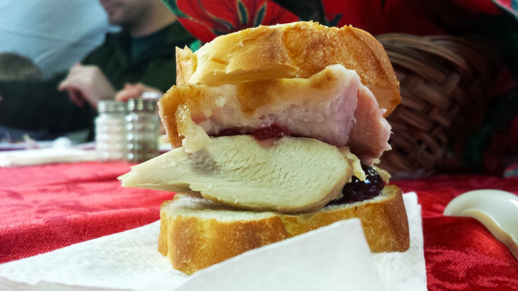 Turkey and Ham with cranberry sauce on French bread