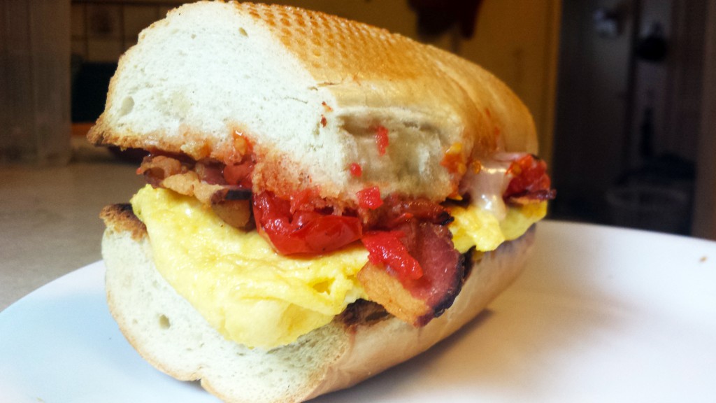 Bacon, egg, cheddar, broiled tomatoes on baguette