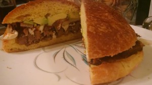 Sliced meat on sandwich.