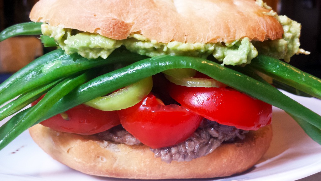 Chacarero with steak, tomatoes, Hungarian wax peppers, green beans and avocado on pan amasado