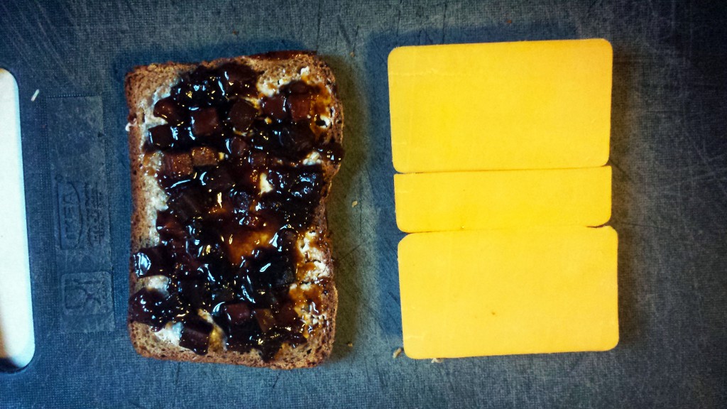 Branston Pickle and sharp Wisconsin cheddar on buttered brown bread