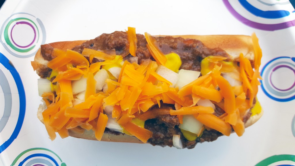 Chili cheddar dog with mustard and onion