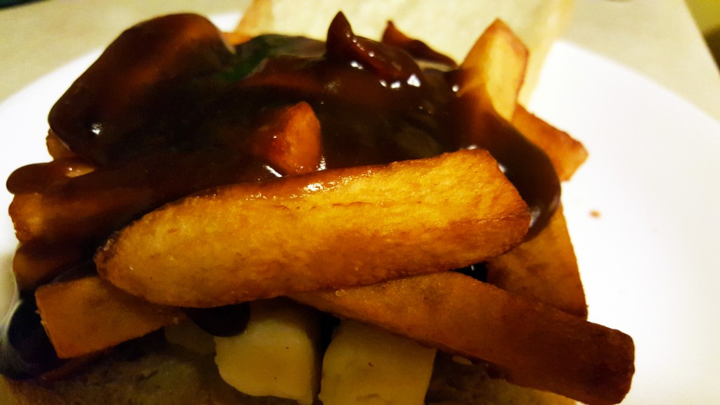 cheddar curds and chips with gravy on home baked sourdough