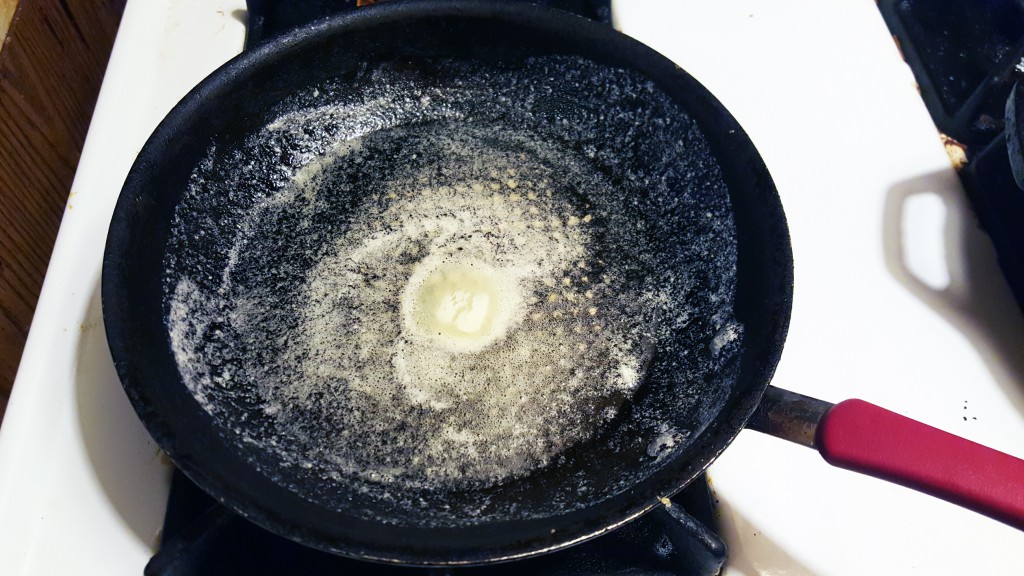 Non-stick slope-sided pan with plenty of butter