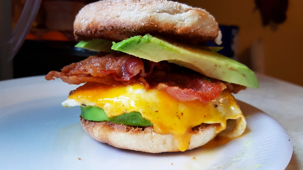 bacon, egg, cheddar, and avocado on a toasted English muffin. 