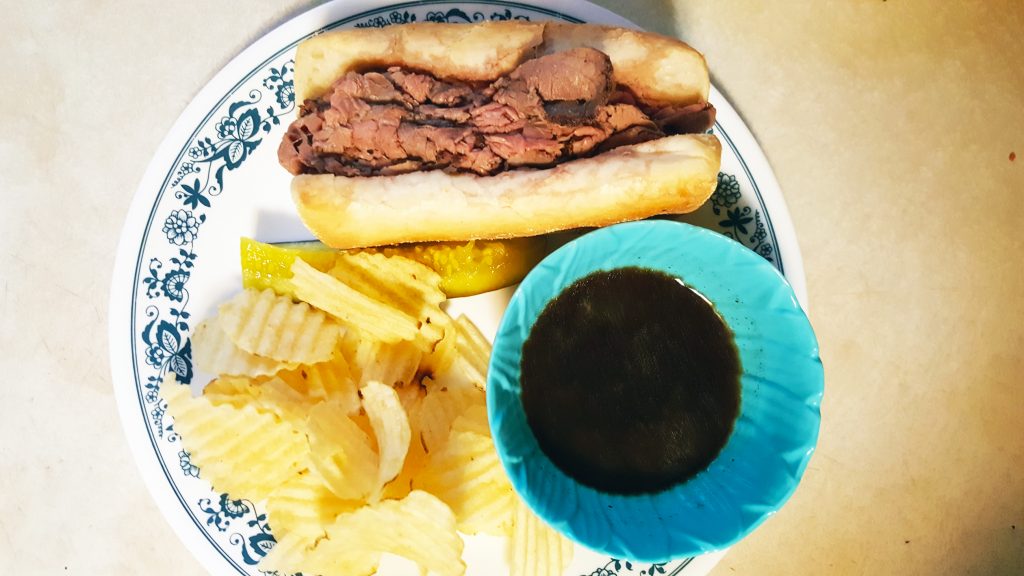 French dip au jus with pickle and chips