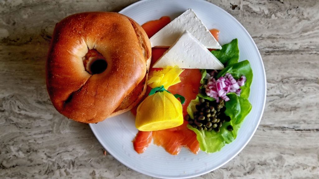 Giant fluffy hotel bagel with smoked salmon and cream cheese