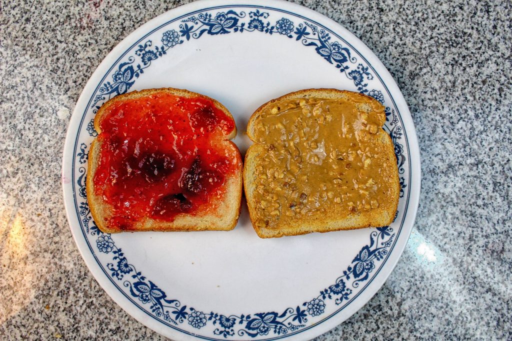 Crunchy peanut butter and strawberry preserves