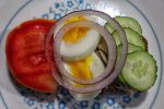 Ruisleipa with herring, cucumber, boiled egg, tomato, onion