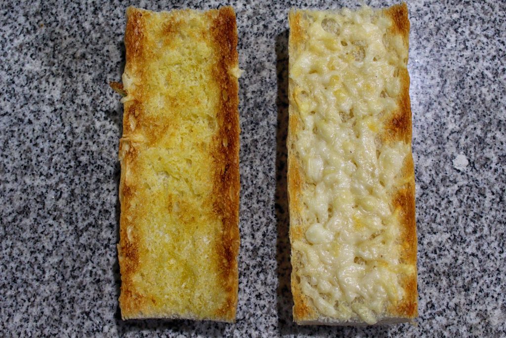 Baguette, buttered, with cheese, broiled