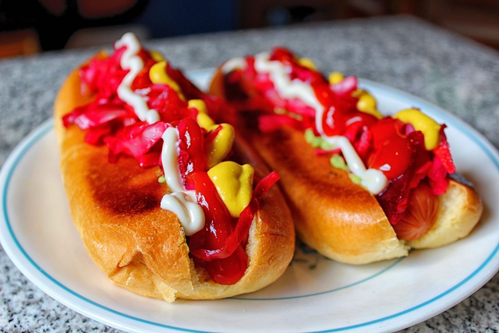Hot dog shucos on top-split buns