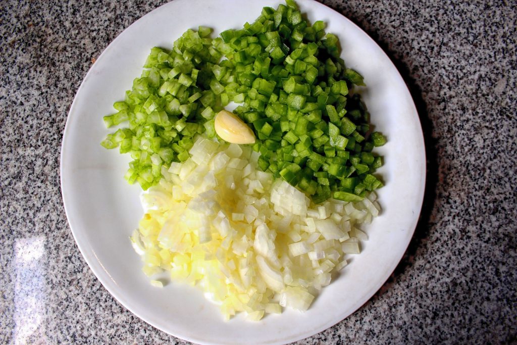 Grandma's recipe starts with onion, green pepper, celery, and garlic