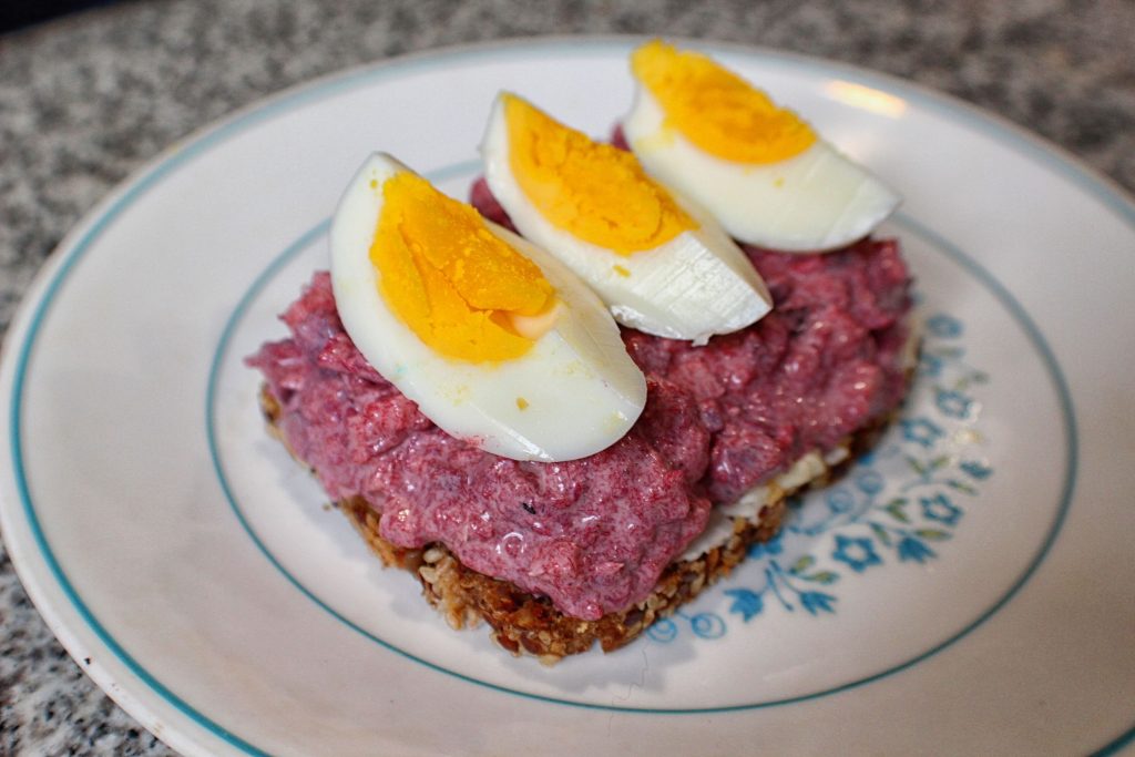 Pickled herring salad with boiled eggs